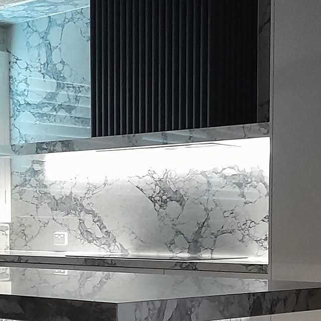 Premium marble and black panel kitchen detail
